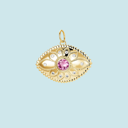 Gold eye pendant with a pink gemstone 