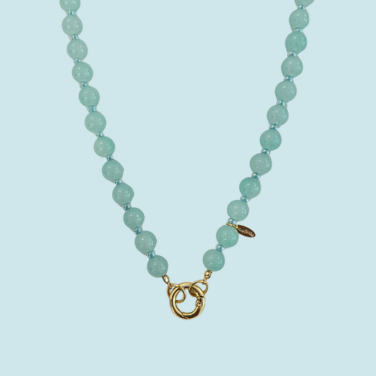 Necklace with Teal glass beads and a gold clasp 
