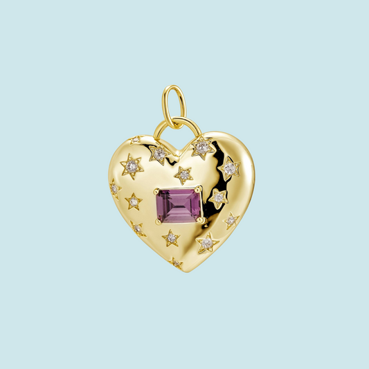 Gold heart-shaped pendant with a purple gemstone 