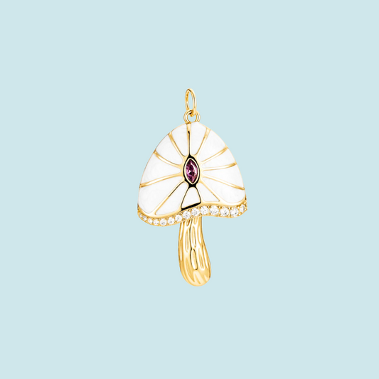 Gold Mushroom pendant with a white enameled top and purple gemstone 